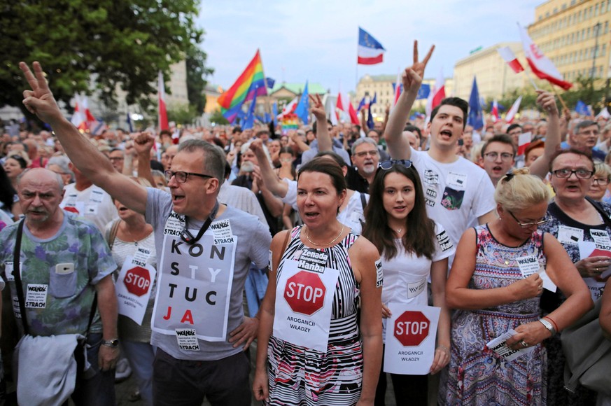 People gather during the &quot;Chain of lights&quot; protest against judicial overhaul in Poznan, Poland July 26, 2018. Agencja Gazeta/Lukasz Cynalewski via REUTERS ATTENTION EDITORS - THIS IMAGE WAS  ...