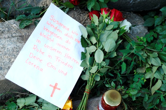 Messages of mourning and flowers are placed by people for Susanna F., the teenager who was found dead two days ago, in Wiesbaden-Erbenheim, Germany, June 8, 2018. REUTERS/Ralph Orlowski