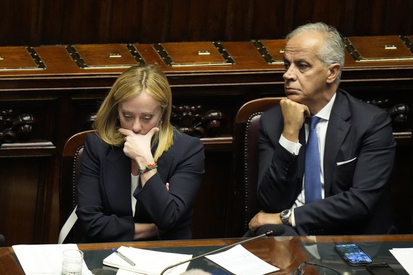 FILE - Italian Premier Giorgia Meloni, left, with Interior Minister Matteo Piantedosi at the lower Chamber on Oct. 25, 2022. Italy’s new interior minister on Wednesday, Nov. 2, 2022, defended a govern ...
