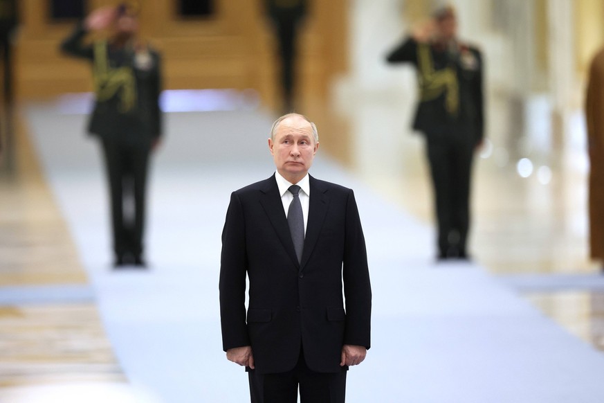 UAE Russia 8576114 06.12.2023 Russian President Vladimir Putin attends a welcoming ceremony before a meeting with President of the United Arab Emirates Sheikh Mohamed bin Zayed Al Nahyan at Qasr Al Wa ...
