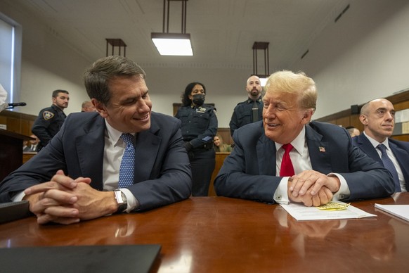 Former President Donald Trump shares a light moment with his lawyer Todd Blanche while he attends his trial at Manhattan Criminal Court, Tuesday, May 28, 2024, in New York. (Steven Hirsch/New York Pos ...