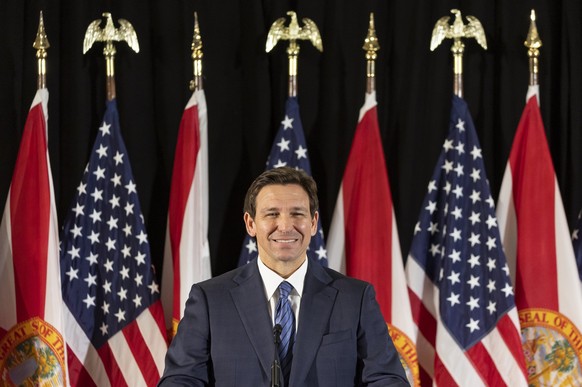 Florida Gov. Ron DeSantis answers questions from the media during a press conference at Christopher Columbus High School on Monday, March 27, 2023, in Miami. The press conference was held to announce  ...