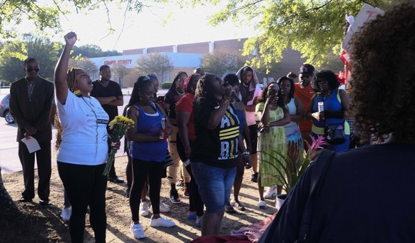 May 17, 2022, Decatur, Georgia, USA: A group of mourners gathered in the parking lot of a Big Bear grocery store in Decatur, GA to hold a memorial for the ten victims of a racist mass shooter in Buffa ...