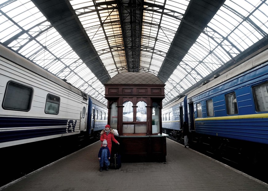 March 12, 2022, Lviv, Ukraine: A woman and her son stand on the platform after arriving from Dnipro as Ukrainian refugees move through Lviv Railway Station as many people flee to neighboring countries ...