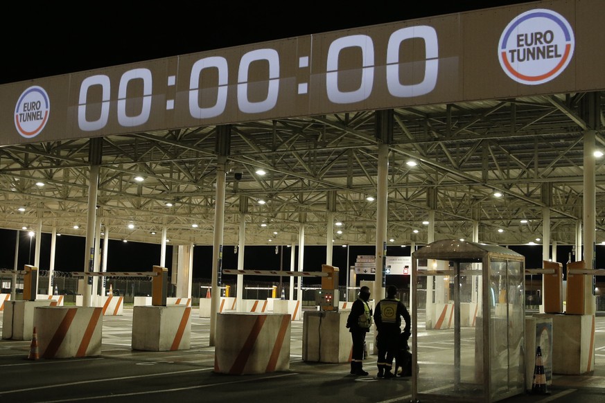 Security officers patrol at the Eurotunnel terminal Friday, Jan.1, 2021 in Coquelles, northern France. Eleven months after Britain&#039;s formal departure from the EU, Brexit becomes a fact of daily l ...