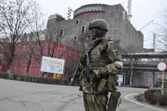 Ukraine Russia Military Operation 8136325 08.03.2022 An armed Russian serviceman is seen on the territory of the Zaporozhye nuclear power plant located in the steppe zone on the shore of the Kakhovsky ...