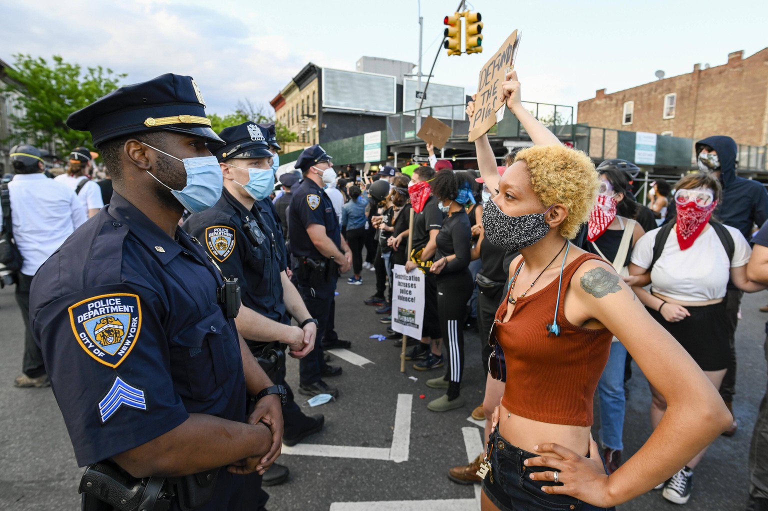 A protester faces police when Black Lives Matter protesters clash with NYPD officers as protests continue over the death of George Floyd at the hands of the Minneapolis police, in New York City on Sat ...