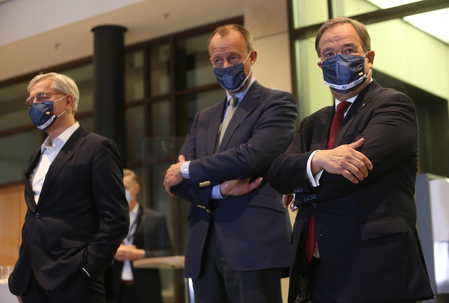 BERLIN, GERMANY - OCTOBER 17: (L to R) Bundestag member Norbert Röttgen, lawyer Friedrich Merz and North Rhine-Westphalia Prime Minister Armin Laschet arrive for a debate in the run-up to the decision ...