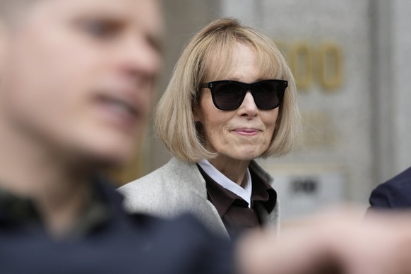 Former advice columnist E. Jean Carroll leaves Manhattan federal court with her attorneys, Tuesday, April 25, 2023, in New York. Jurors have been seated in the trial over Carroll&#039;s claim that for ...
