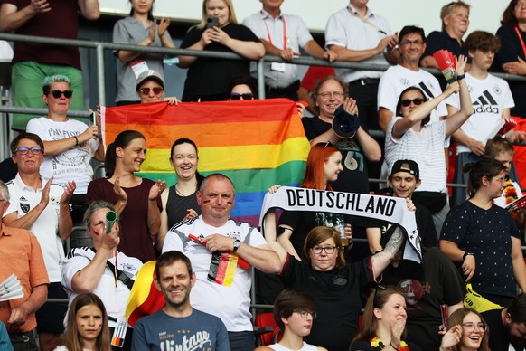 ERFURT, GERMANY - JUNE 24: Fans show their support as they display a rainbow flag from the stands prior to the Women&#039;s International friendly match between Germany and Switzerland at Steigerwalds ...