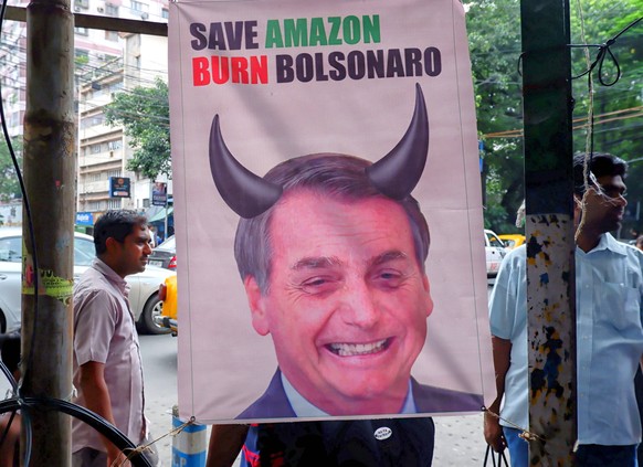 August 27, 2019, Kolkata, West Bengal, India: A banner of the Brazilian President Jair Bolsonaro hangs in front of the main road of Brazil Consulate during the protest..Brazil s president Jair Bolsona ...