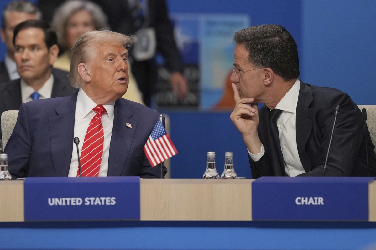 United States President Donald Trump, left, speaks to Nato General Secretary Mark Rutte during a North Atlantic Council plenary meeting during the the NATO summit in The Hague, Netherlands, Wednesday, ...