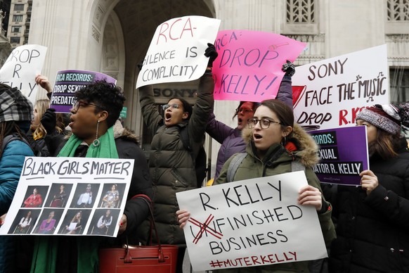 Demonstrators chant during an R. Kelly protest outside Sony headquarters, in New York, Wednesday, Jan. 16, 2019. Kelly has been under fire since the recent airing of a Lifetime documentary &quot;Survi ...