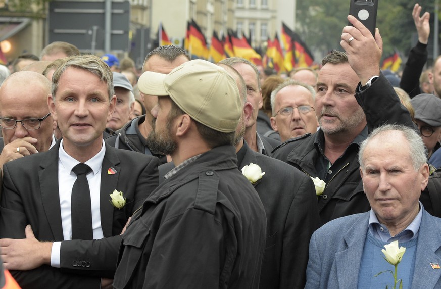 FILE - In this Sept. 1, 2018 file photo Bjoern Hoecke, left, leader of the Alternative for Germany, AfD, in German state of Thuringia, and Pegida founder Lutz Bachmann, second from right, participate  ...