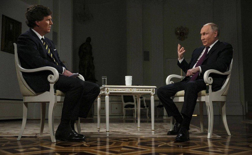February 9, 2024, Moscow, Russia: Russian President Vladimir Putin, right, responds to a question from conservative television personality Tucker Carlson during an interview at the Kremlin, February 9 ...