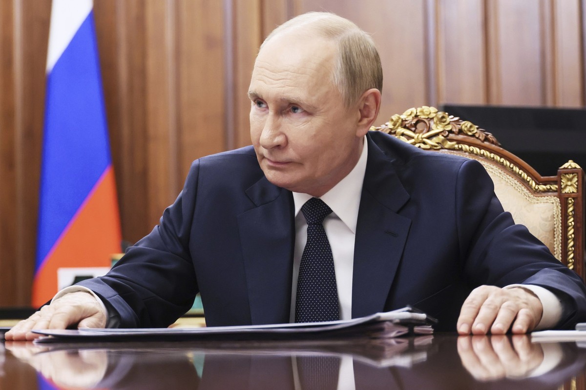 Russian President Vladimir Putin speaks with the head of the Russian-controlled Donetsk region Denis Pushilin during their meeting at the Kremlin in Moscow, Russia, Monday, Aug. 4, 2025. (Mikhail Metz ...