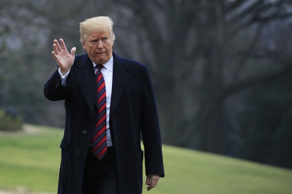 President Donald Trump walks on the South Lawn upon arrival at the White House in Washington, Saturday, Jan. 19, 2019, after attending the casualty return at Dover Air Force Base, Del., for the four A ...