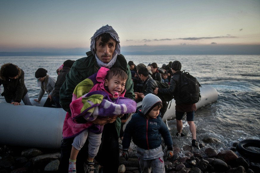 March 2, 2020, Skala Sikaminias, Lesvos Island, Greece: Refugees from Afghanistan arrive at the village of Skala Sikaminias, on the Greek island of Lesbos, after crossing on a dinghy the Aegean sea fr ...