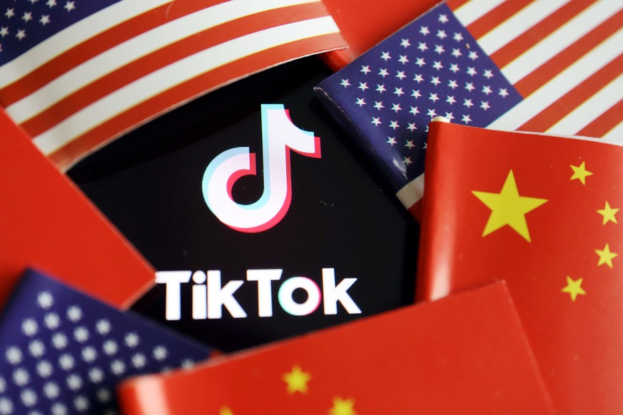 FILE PHOTO: Chinese and U.S. flags are seen near a TikTok logo in this illustration picture taken July 16, 2020. REUTERS/Florence Lo/Illustration/File Photo