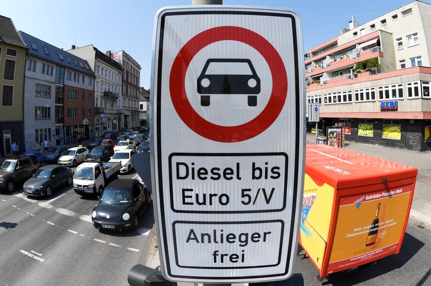 A truck passes by a traffic sign, which bans diesel cars at the Max-Brauer Allee in downtown Hamburg, Germany, May 31, 2018. REUTERS/Fabian Bimmer