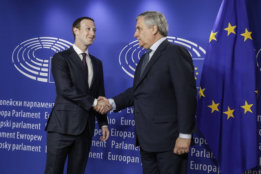 Facebook CEO Mark Zuckerberg (L) shakes hands with European Parliament President Antonio Tajani at the European Parliament ahead of the audition of Facebook CEO on the data privacy scandal, in Brussel ...