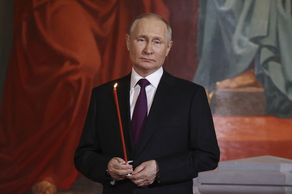 FILE - Russian President Vladimir Putin attends an Orthodox Easter service in the Christ the Savior Cathedral in Moscow, Russia, April 15, 2023. President Vladimir Putin is likely to win another six-y ...