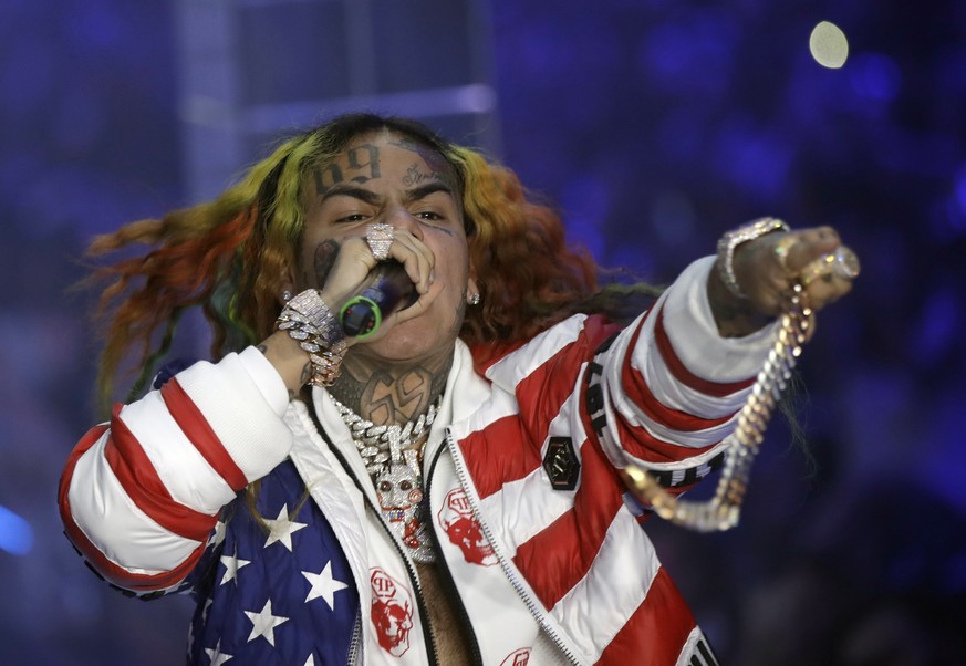 FILE- In this Sept. 21, 2018, file photo rapper Daniel Hernandez, known as Tekashi 6ix9ine, performs during the Philipp Plein women's 2019 Spring-Summer collection, unveiled during the Fashion Week in ...