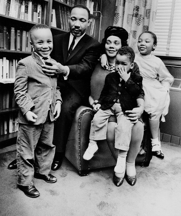 FILE - In this March 17, 1963, file photo, Dr. Martin Luther King Jr. and his wife, Coretta Scott King, sit with three of their four children in their Atlanta, Ga., home. From left are: Martin Luther  ...