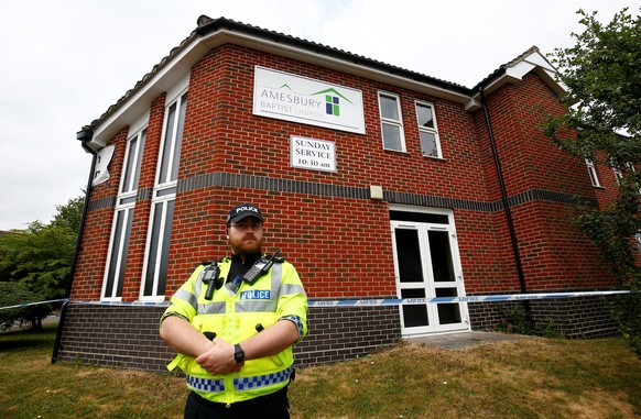 A police officer stands in front of Amesbury Baptist Church, which has been cordoned off after two people were hospitalised and police declared a 'major incident', in Amesbury, Wiltshire, Britain, Jul ...
