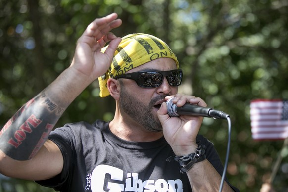 Patriot Prayer founder and rally organizer Joey Gibson speaks to his followers at a rally in Portland, Ore., Saturday, Aug. 4, 2018. Small scuffles broke out Saturday as police in Portland, Oregon, de ...
