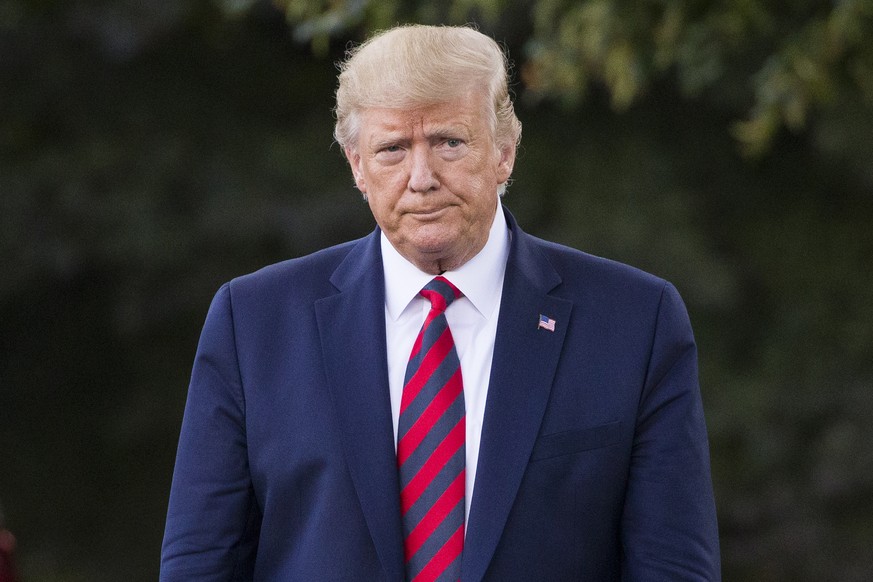 President Donald Trump walks to speak with reporters before departing on Marine One from the South Lawn of the White House, Thursday, Sept. 12, 2019, in Washington. Trump is en route to Baltimore.(AP  ...