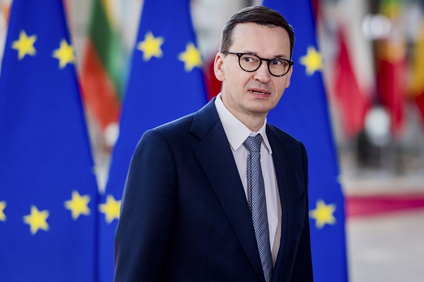 FILE - Poland&#039;s Prime Minister Mateusz Morawiecki arrives for the second day&#039;s session of an extraordinary meeting of EU leaders to discuss Ukraine, energy and food security at the Europa bu ...