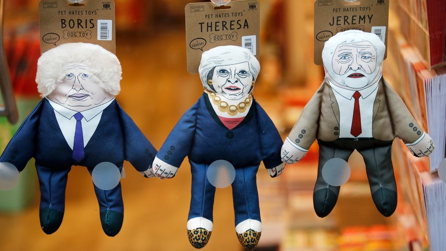 Toys for dogs themed on Britain's Prime Minister Theresa May, former Foreign Secretary Boris Johnson and leader of the Labour Party Jeremy Corbyn are displayed for sale in the window of a pet shop in  ...