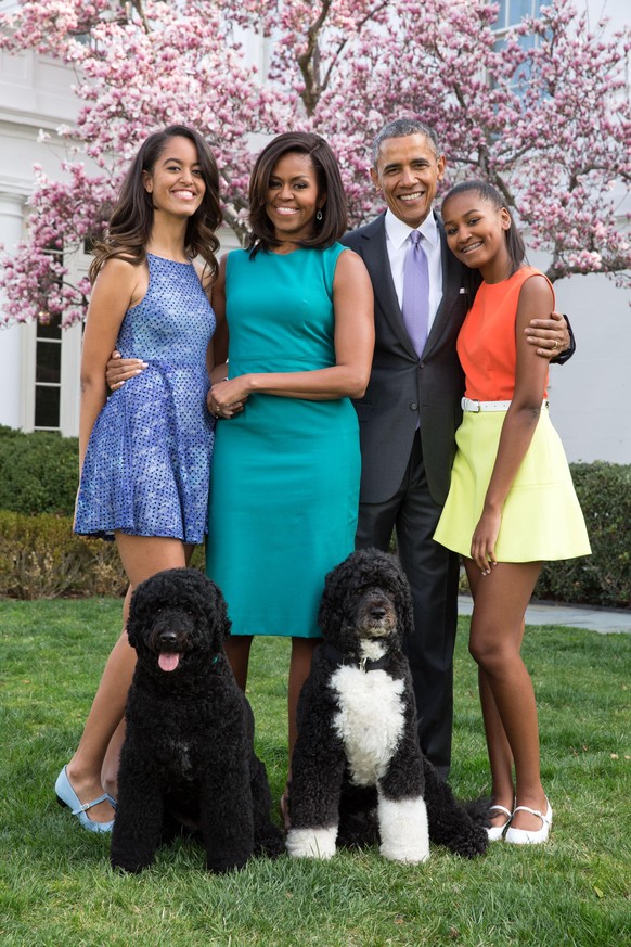 WASHINGTON, DC - APRIL 05: U.S. President Barack Obama, First Lady Michelle Obama, and daughters Malia (L) and Sasha (R) pose for a family portrait with their pets Bo and Sunny in the Rose Garden of t ...