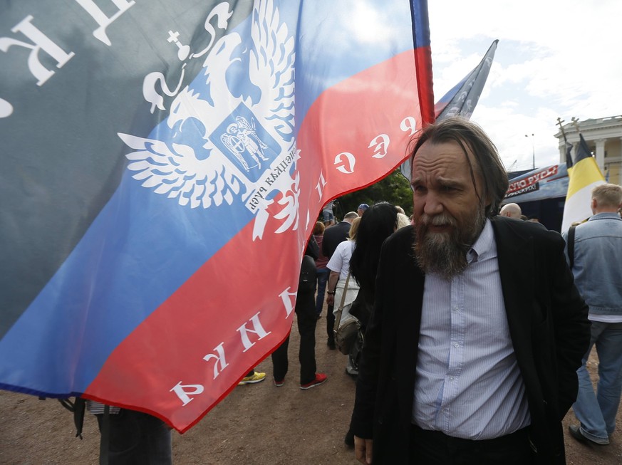 ITAR-TASS: MOSCOW, RUSSIA. JUNE 11, 2014. Philosopher, expert on geopolitics, Alexander Dugin at a rally in central Moscow in support of the people of Donbass. PUBLICATIONxINxGERxAUTxONLY RE146FB2

 ...