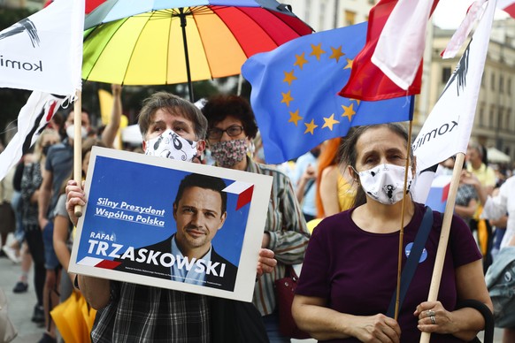 Supporters of Rafal Trzaskowski and other opposition prodemocracy candidates attend a protest 'A Change Is Coming' against the presidency of Andrzej Duda who is running for re-election. Krakow, Poland ...