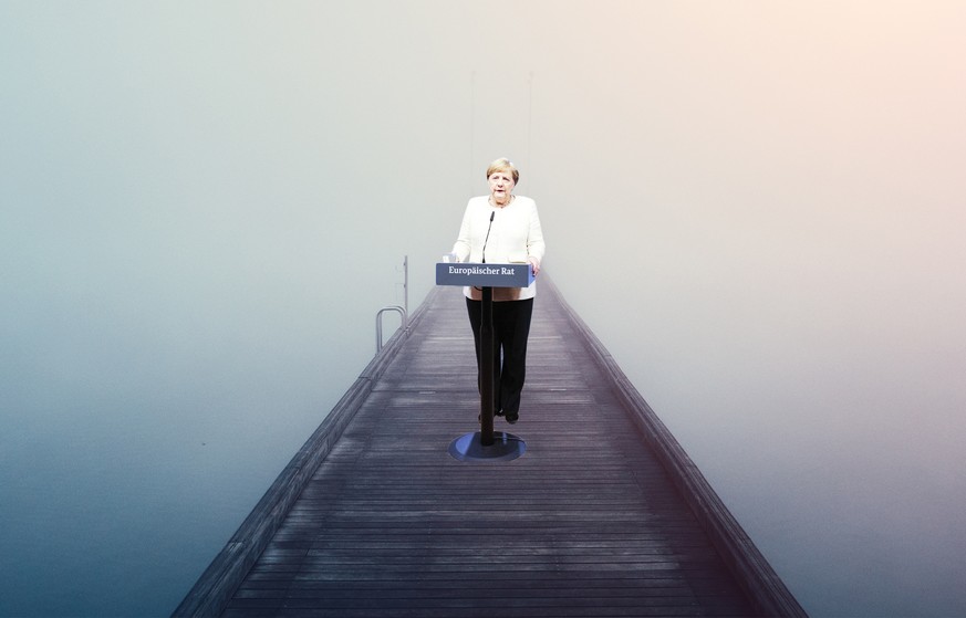 Woman crossing the bridge over lake on a foggy winter day.