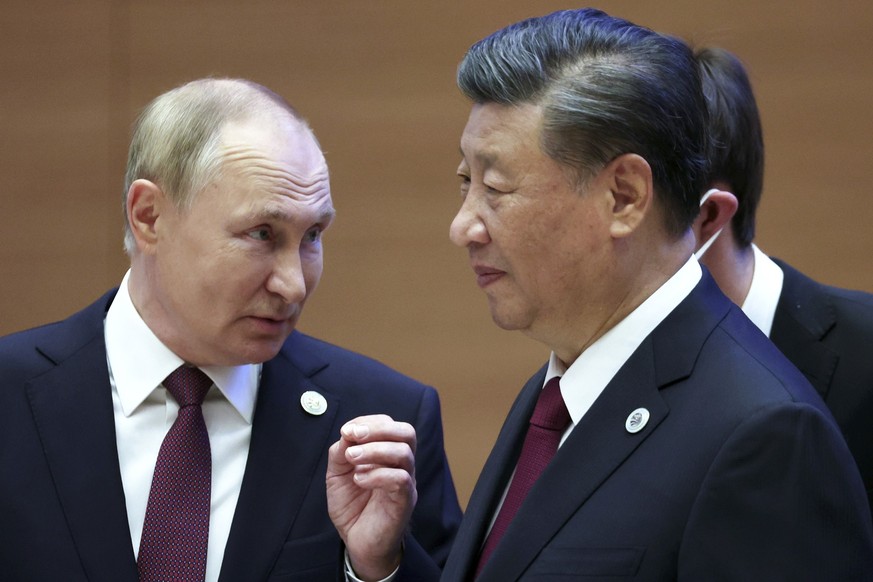 FILE- Russian President Vladimir Putin, left, gestures while speaking to Chinese President Xi Jinping during the Shanghai Cooperation Organization (SCO) summit in Samarkand, Uzbekistan, Sept. 16, 2022 ...