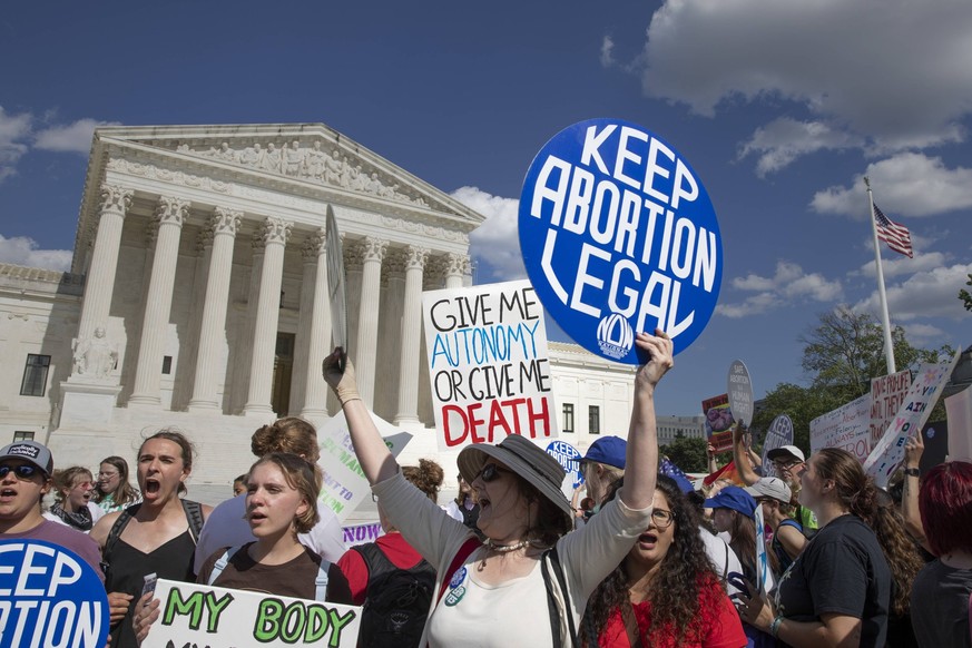 Abortion Rights Activists Protest Washington DC Women are showing signs when the abortion rights activists are protesting in front of the US Supreme Court in Washington, DC on June 24, 2024. This demo ...