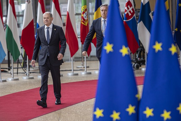Olaf Scholz At The Special Meeting Of The European Council In Brussels Olaf Scholz Federal Chancellor of Germany arrives at the special EU summit, walking next to the European flags, flag of Europe an ...