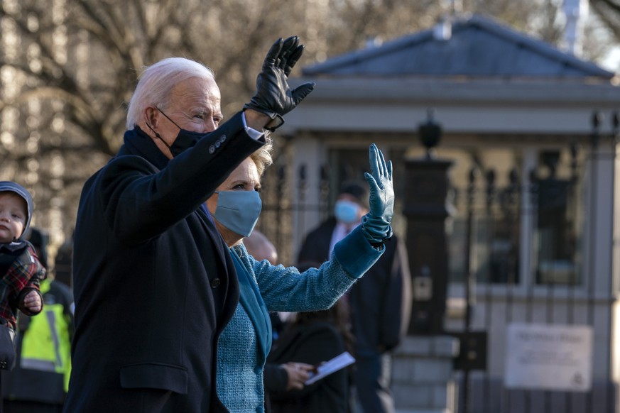 President Joe Biden and First Lady Jill Biden, walk near the White House during a Presidential Escort to the White House, Wednesday, Jan. 20, 2021 in Washington.(AP Photo/Jose Luis Magana)