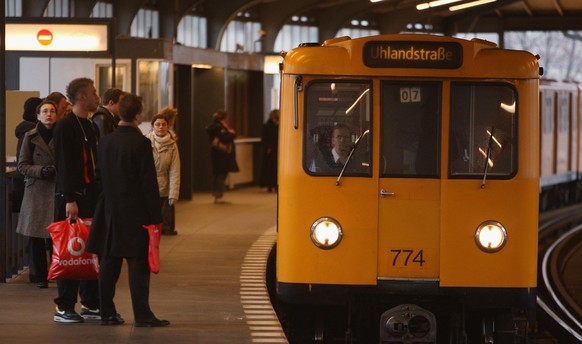 BERLIN - FEBRUARY 19: An U-Bahn commuter train of the BVG, the city transport authority, arrives at a station on February 19, 2008 in Berlin, Germany. Workers in Germany&#039;s public sector are joini ...