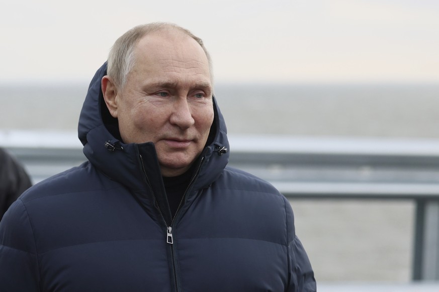 Russian President Vladimir Putin visits the Crimean Bridge connecting Russian mainland and Crimean peninsula over the Kerch Strait, which was damaged by a truck bomb attack in October, after restorati ...