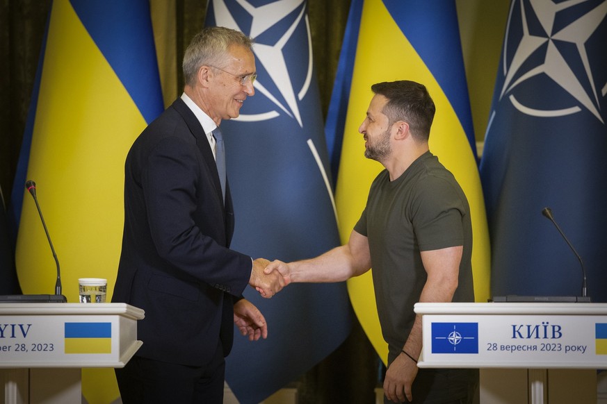 NATO Secretary General Jens Stoltenberg, left, and Ukrainian President Volodymyr Zelenskyy shake hands after their press conference in Kyiv, Ukraine, Thursday, Sept. 28, 2023. (Ukrainian Presidential  ...