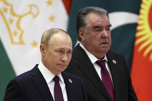 Russian President Vladimir Putin, left, and Tajikistan's President Emomali Rahmon arrive to attend the Shanghai Cooperation Organisation (SCO) summit in Samarkand, Uzbekistan, Friday, Sept. 16, 2022. ...