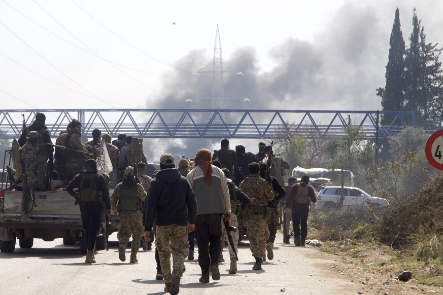 250307 -- LATAKIA SYRIA, March 7, 2025 -- Syrian security forces are seen on the Tartous-Latakia highway in Latakia province, northwestern Syria, on March 7, 2025. Syrian security forces on Friday lau ...