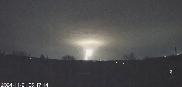 In this screen grab from a video provided by the Come Back Alive Foundation on Nov. 21, 2024, lights are seen in the sky during a Russian attack on Dnipro, Ukraine. (Ukrainian Emergency Service via AP ...