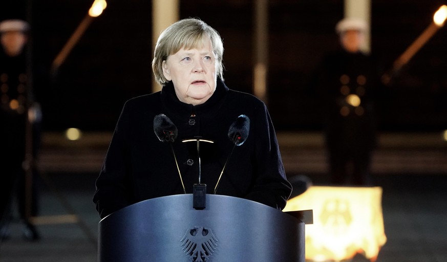 BERLIN, GERMANY - DECEMBER 02: Outgoing German Chancellor Angela Merkel delivers a speech as she attends her military tattoo ceremony hosted by the Bundeswehr on December 02, 2021 in Berlin, Germany.  ...