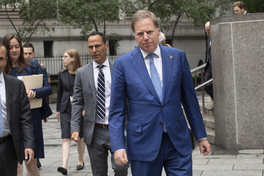 Geoffrey Berman, front, the United States Attorney for the Southern District of New York, leaves federal court in New York after a judge denied bail to Jeffrey Epstein, Thursday, July 18, 2019. (AP Ph ...