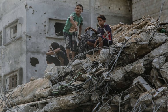 Israel Increases Strikes On Gaza Three children wander around the rubbles of ruined buildings that were destroyed by the Israeli airstrikes in Gaza. Gaza Strip, October 25, 2023. Israel escalated its  ...
